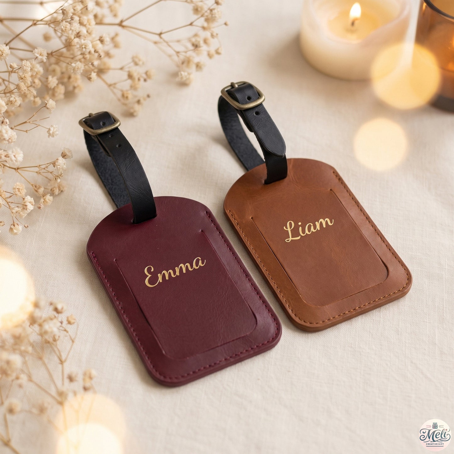 Backs of two personalized luggage tags with gold names Emma and Liam, burgundy and cognac leather